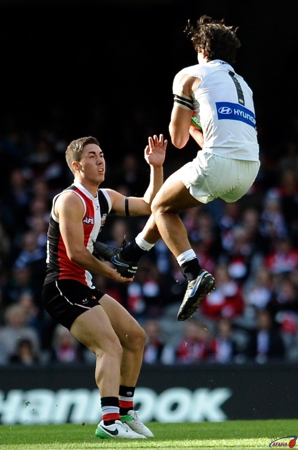 Jack Silvagni takes a flying defensive mark as Jade Gresham contests