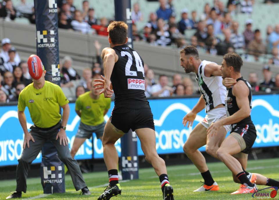 Cloke shepherds the Saints defence as a long kick goes through for a behind