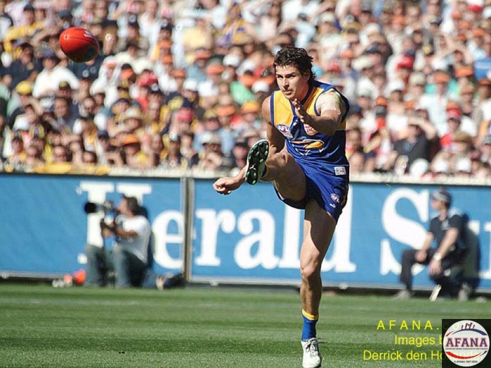 [b]Norm Smith Medallist of the 2006 AFL Grand Final Andrew Embley kicks the ball long from defence[/b]