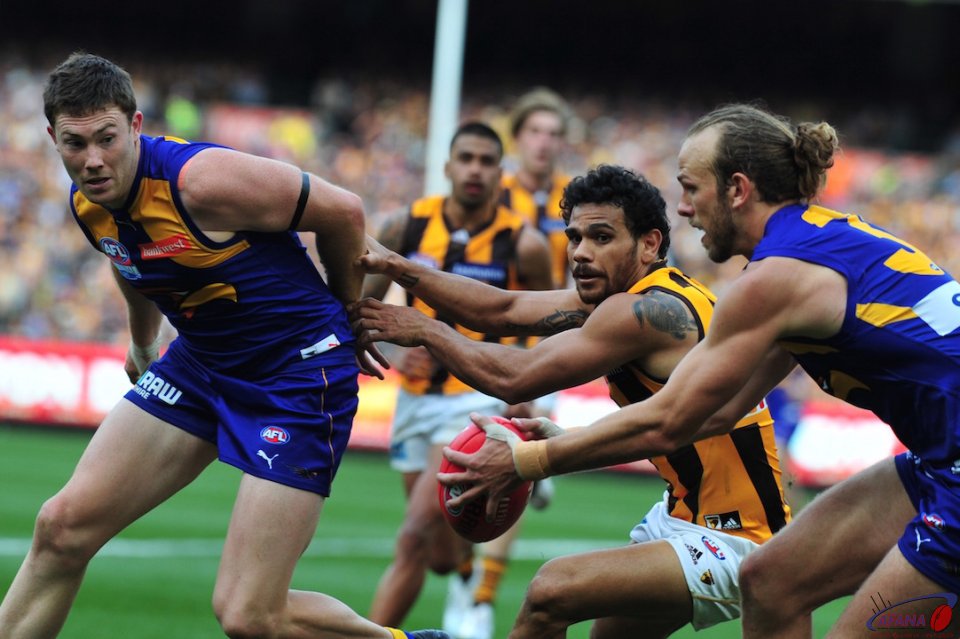 Schofield grabs the ball as McGovern sheppards Rioli