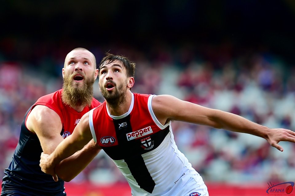 Gawn and Longer contest the ruck.