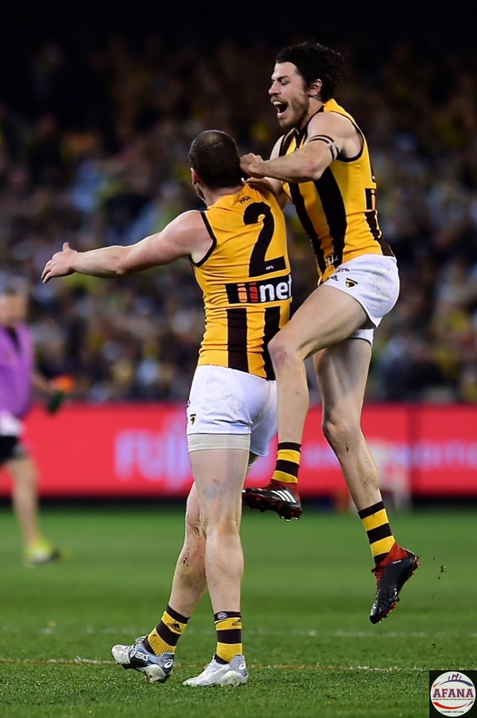 Jarryd Roughead and Isaac Smith celebrate