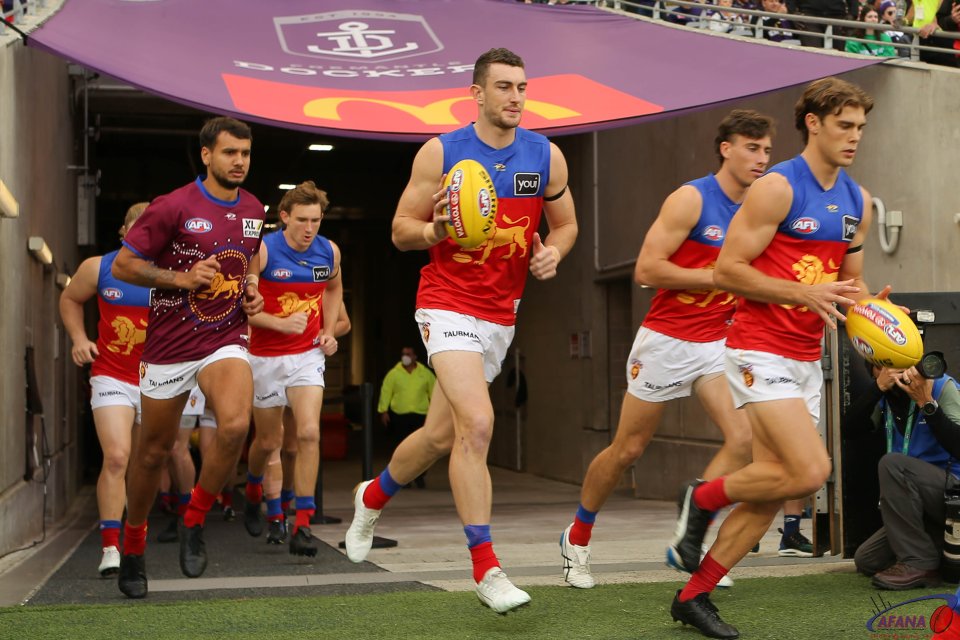 Brisbane Lions players run out