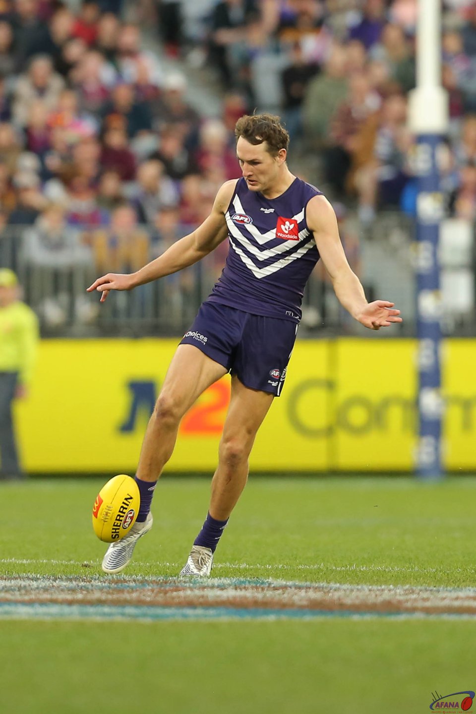 Brennan Cox clears for the Dockers
